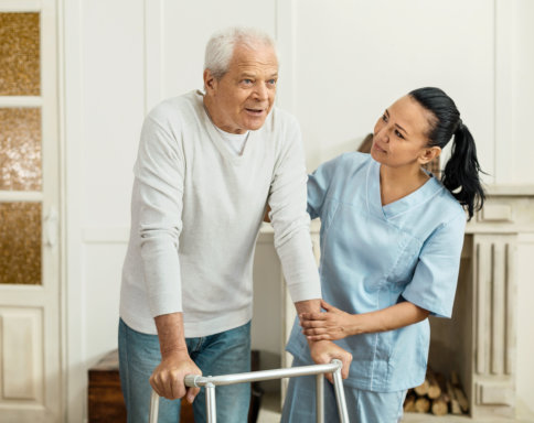 healthcare aide looking after the elderly man
