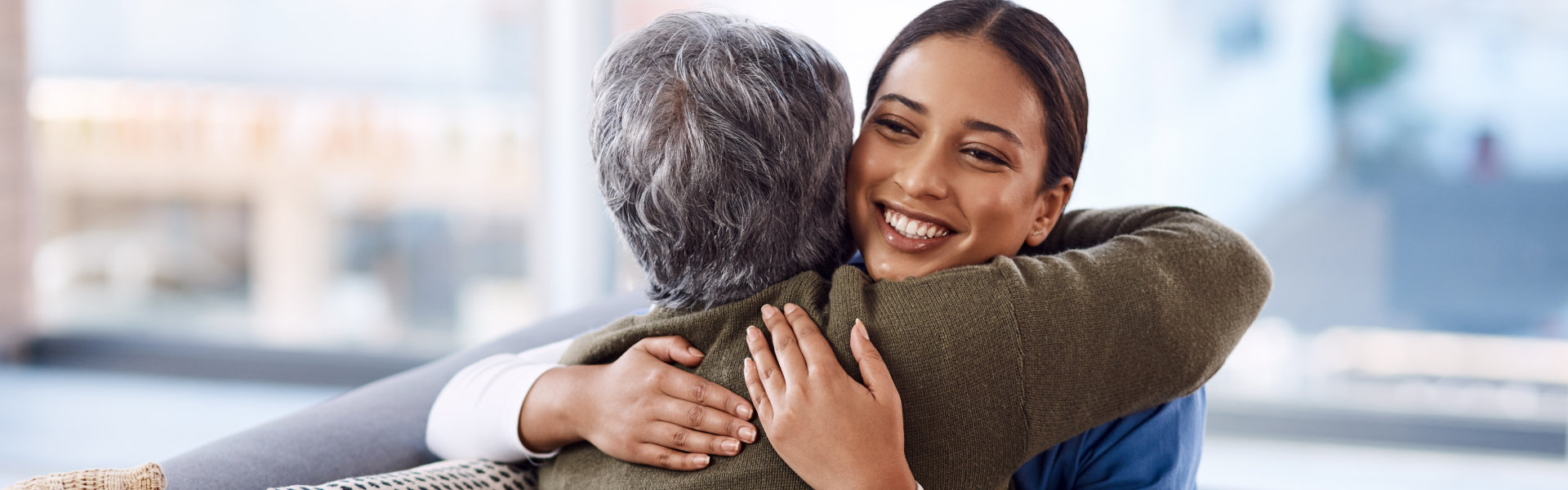 nurse hugging a woman